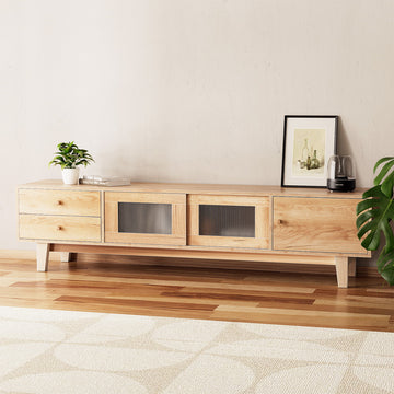 Natural wood TV unit with 2 stacked drawers 2 sliding ribbed glass doors and 1 side door on wood floor