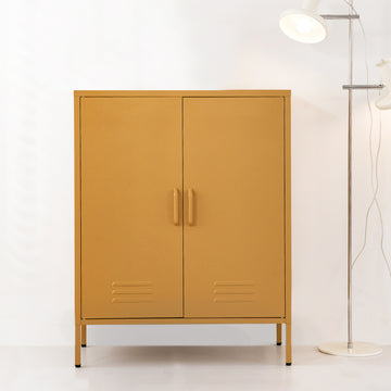 Mustard yellow two-door metal locker cabinet with bar handles and louvre vents beside chrome floor lamp