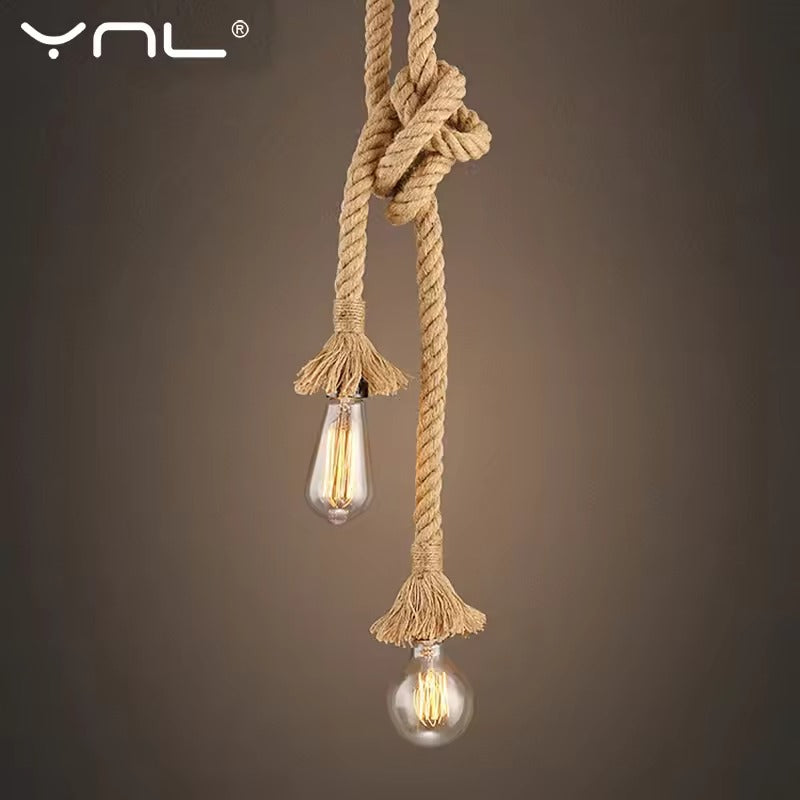 YNL hemp rope double pendant light with two Edison bulbs, teardrop and globe, knotted rope against grey background
